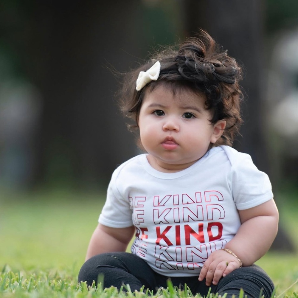 White Baby Tee with Red "Be Kind" Text